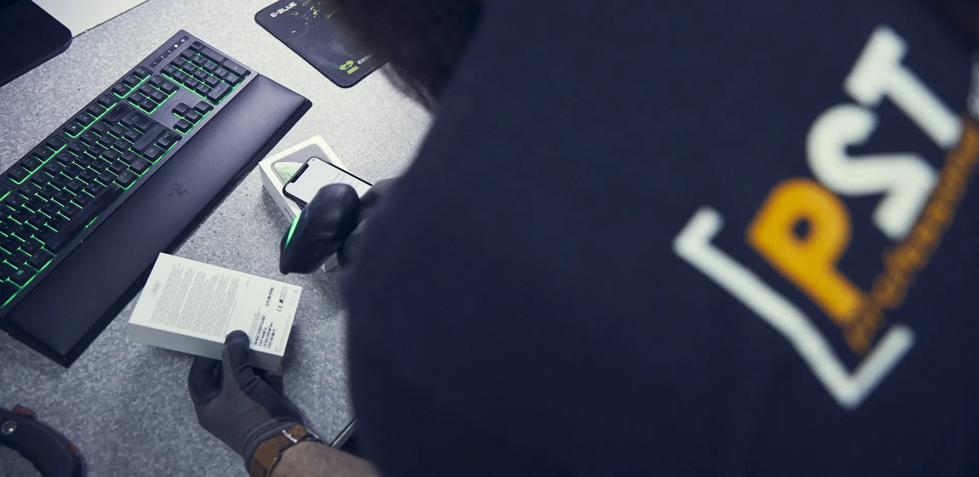 Employee scanning the barcode of a returned device
